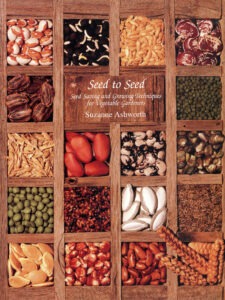 The cover of a book titled "Seed to Seed: Seed Saving and Growing Techniques for Vegetable Gardeners" by Suzanne Ashworth. A variety of seeds organized in a wooden grid.