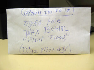 A white envelope labeled "Myra Pole Wax Bean"