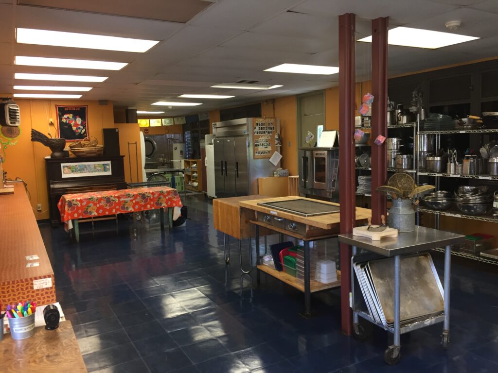 A large commercial-style kitchen classroom for food-related curriculum
