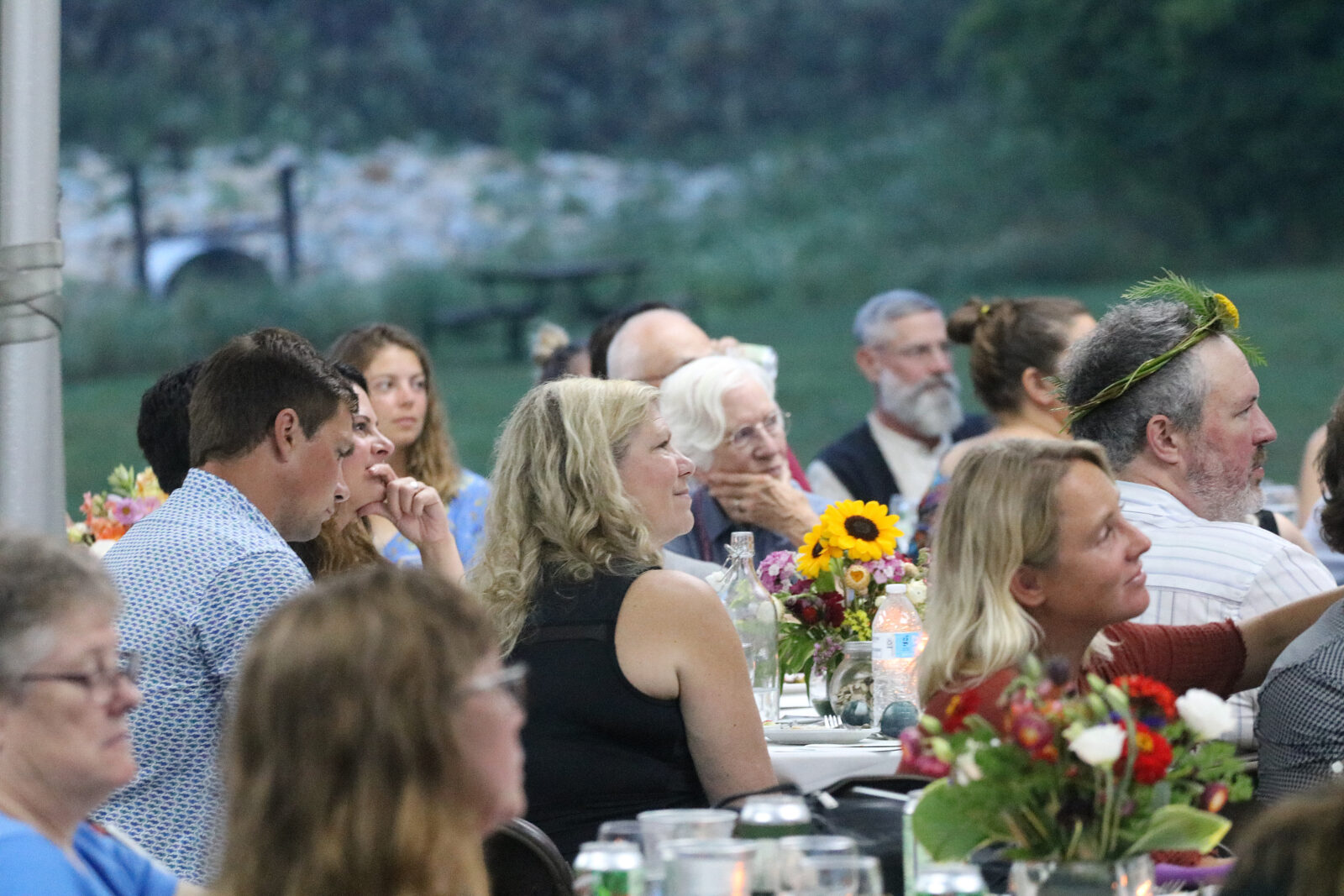 People sitting at tables outdoors