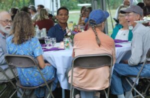 A group of people sitting at a table conversing